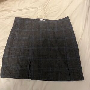 Aritiza Sunday best plaid skirt with two slits.